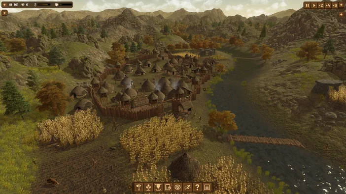 Capture d'écran du jeu vidéo Dawn of Man montrant une vue aérienne sur un village préhistorique entouré de palissades, des champs cultivés et une rivière au pied de montagnes rocheuses.