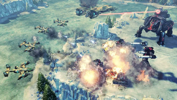 Capture d'écran de Command & Conquer™ 4 Tiberian Twilight montrant une bataille dans un paysage enneigé avec des explosions et des véhicules militaires.