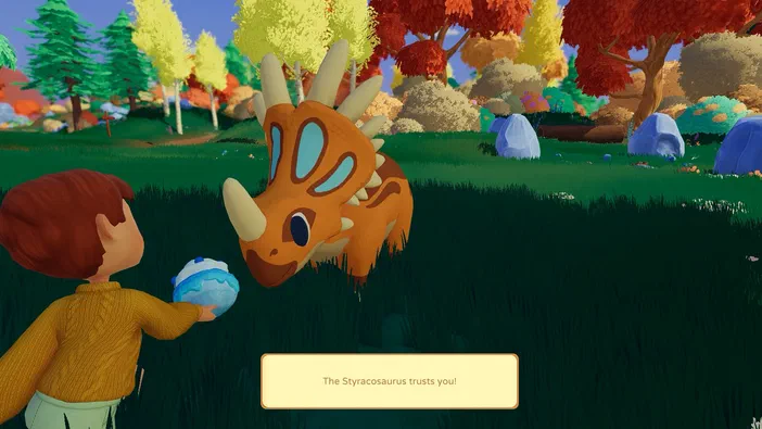Dans le jeu vidéo Paleo Pines, un personnage offre sa confiance au dinosaure Styracosaurus orange qui se penche vers lui dans une forêt colorée.