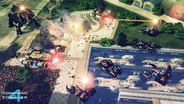 Capture d'écran du jeu Command & Conquer™ 4 Tiberian Twilight montrant un combat de véhicules blindés avec des explosions dans un environnement urbain incluant de l'eau.