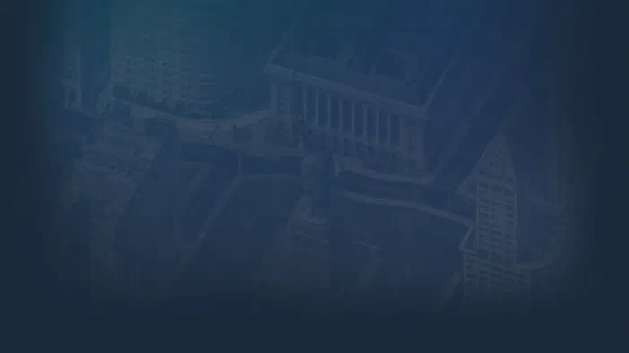 Vue aérienne d'une ville de style classique avec des gratte-ciel et un monument central dans le jeu vidéo SimCity 4 Deluxe.