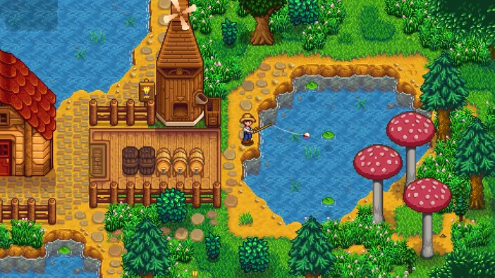 Un personnage portant un chapeau de paille pêche au bord d'un étang verdoyant entouré d'arbres et de grands champignons rouges, près de granges en bois contenant des tonneaux.