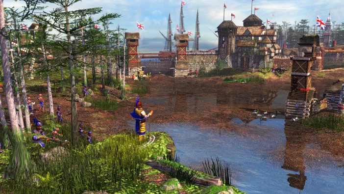 Capture d'écran du jeu vidéo Age of Empires III montrant un village colonial entouré de forêts.