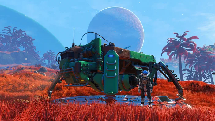 Capture d'écran du jeu vidéo No Man's Sky montrant un astronaute debout à côté d'un grand vaisseau spatial vert posé dans un champ de herbe rouge avec des planètes bleues flottantes en arrière-plan.