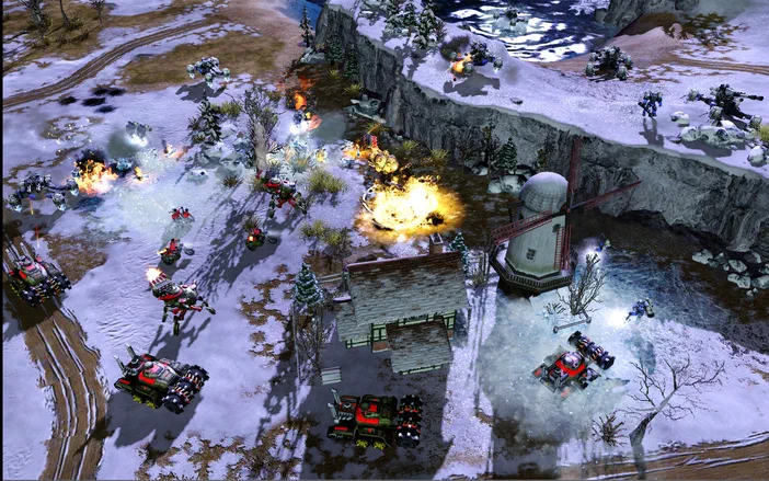 Scène de combat du jeu vidéo Command & Conquer Red Alert 3 Uprising montrant des véhicules militaires, des explosions et des bâtiments dans un paysage enneigé avec moulin à vent.