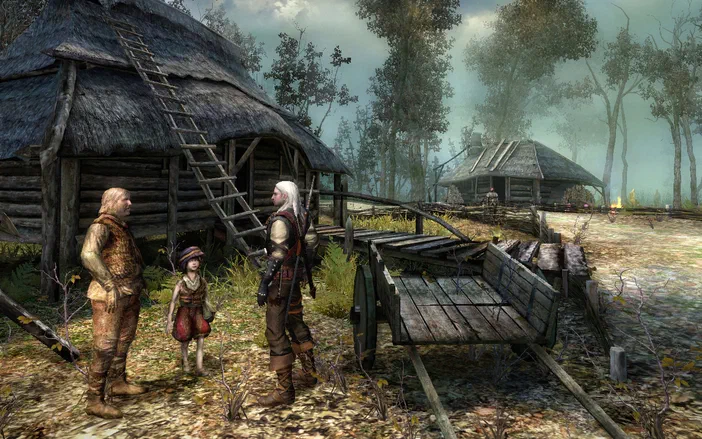 Capture d'écran de The Witcher: Enhanced Edition montrant Geralt discutant avec un homme et une enfant près d'une cabane en bois dans un village.