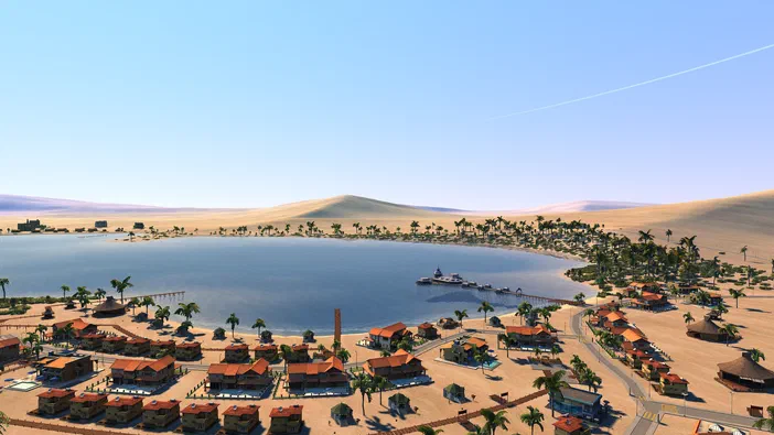Vue aérienne d'une ville de simulation dans le jeu Cities XL Platinum, montrant des bâtiments aux toits rouges alignés sur un littoral sablonneux bordé d'eau bleue et parsemé de palmiers.