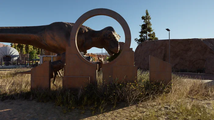 Un Tyrannosaure et un autre dinosaure sont visibles à travers une structure circulaire en métal dans Jurassic World Evolution.