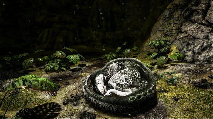 Capture d'écran du jeu vidéo ARK: Survival Evolved montrant un dinosaure enroulé sur lui-même dans une grotte sombre entourée de végétation.