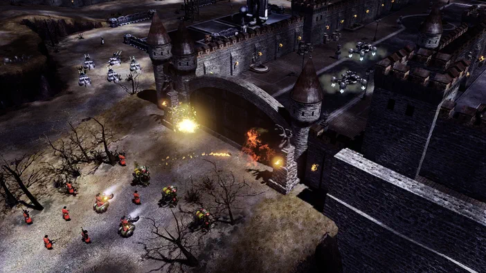 Capture de Command & Conquer Red Alert 3 Uprising montrant des troupes et véhicules attaquant une forteresse médiévale avec explosions.