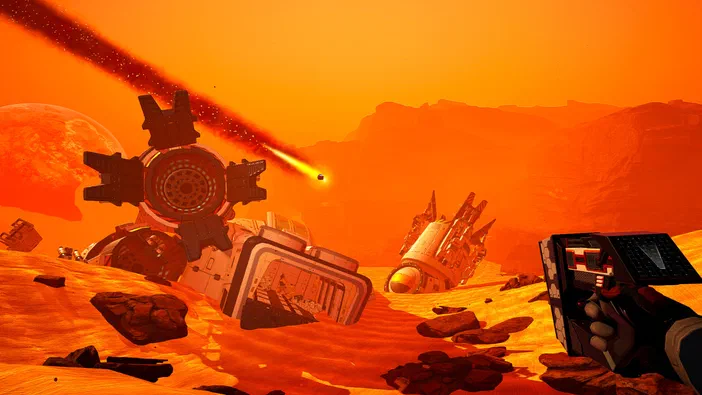 Capture d'écran du jeu vidéo The Planet Crafter montrant un paysage désertique orange avec des vaisseaux spatiaux échoués et une main tenant un appareil dans le coin inférieur droit.