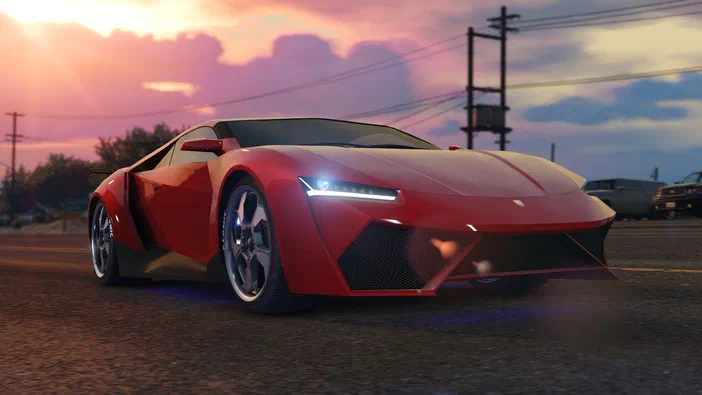 Sous un ciel crépusculaire rose et violet, une voiture de sport rouge aux lignes anguleuses est stationnée sur une route asphaltée dans le jeu vidéo Grand Theft Auto V.