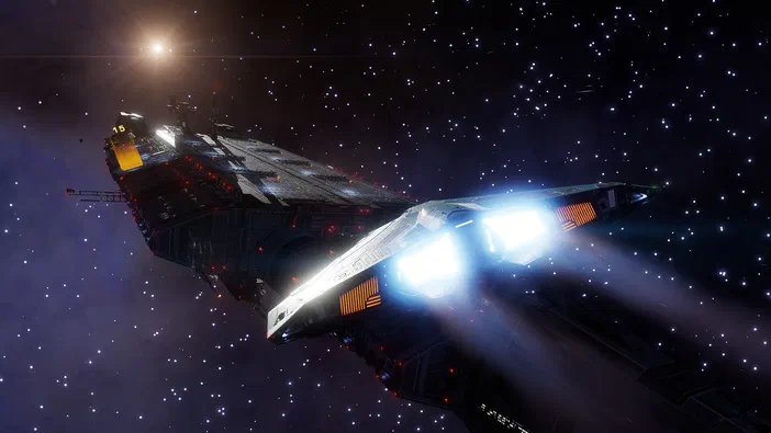 Capture d'écran du jeu vidéo Elite Dangerous montrant un vaisseau spatial en vol dans l'espace étoilé avec ses propulseurs allumés.