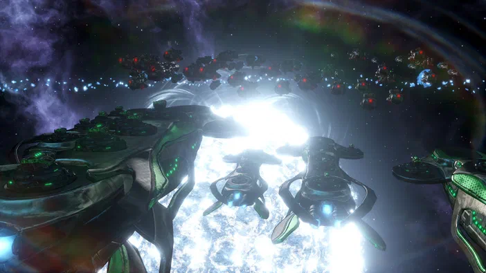 Capture d'écran du jeu vidéo Stellaris montrant une flotte de vaisseaux spatiaux verts et noirs se dirigeant vers un portail lumineux dans l'espace.