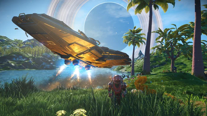 Dans le jeu vidéo No Man's Sky, un vaisseau spatial atterrit près d'un lac sur une planète verdoyante avec des palmiers et un anneau lumineux dans le ciel.