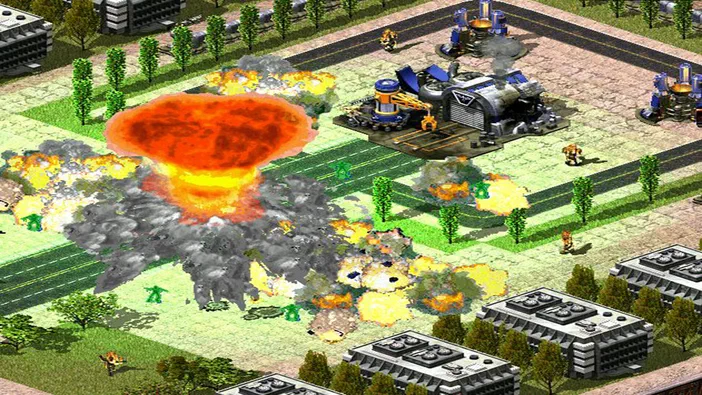 Dans Command & Conquer : Red Alert 2 et Yuri's Revenge, une explosion massive détruit des bâtiments urbains tandis que des unités militaires s'affrontent sur un champ de bataille.