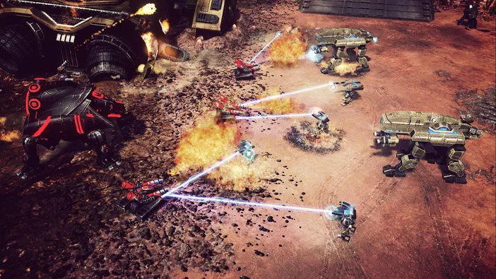 Capture de jeu vidéo Command & Conquer™ 4 Tiberian Twilight montrant une bataille entre des unités mécanisées sur un terrain rougeâtre avec explosions et tirs laser.