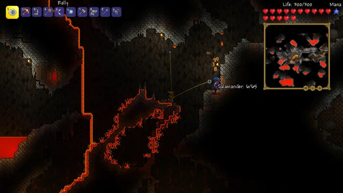 Capture d'écran du jeu Terraria montrant un personnage dans une grotte avec des laves et une carte miniaturisée en haut à droite.