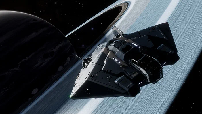 Capture d'écran du jeu vidéo Elite Dangerous montrant un vaisseau spatial devant les anneaux d'une planète.