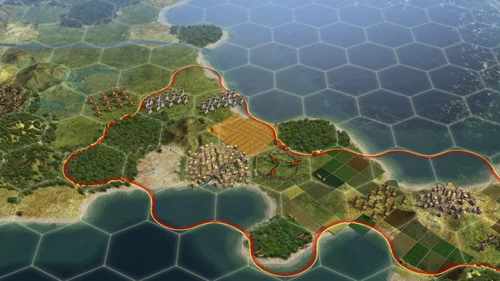 Capture d'écran de Sid Meier's Civilization V montrant une carte hexagonale avec des unités et des villes entourées par un territoire rouge.