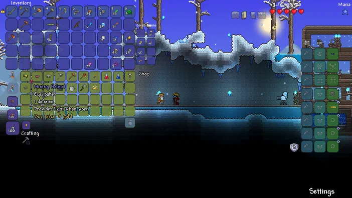 Capture d'écran du jeu Terraria montrant un personnage dans une grotte enneigée avec des interfaces utilisateur à gauche et à droite.