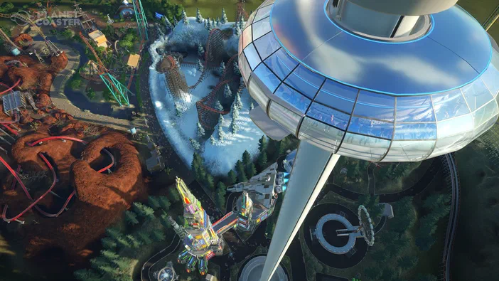 Vue aérienne d'un parc de divertissement dans le jeu Planet Coaster, montrant des montagnes russes colorées et une grande tour futuriste.