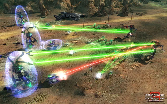 Capture d'écran de Command & Conquer 3: Kane's Wrath montrant une bataille avec des troupes et des lasers verts sur un terrain aride.