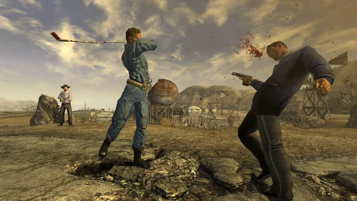 Capture d'écran de Fallout: New Vegas montrant un personnage brandissant une batte et un autre tenant un pistolet dans un désert post-apocalyptique.