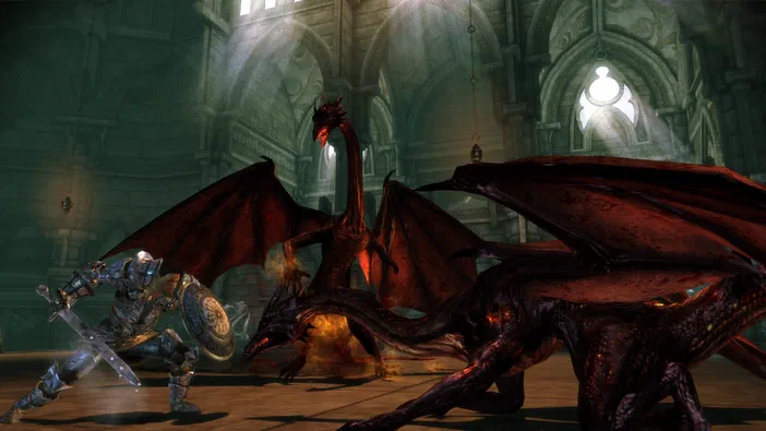 Dans Dragon Age: Origins - Awakening, un chevalier en armure affronte deux dragons rouges dans une cathédrale sombre.
