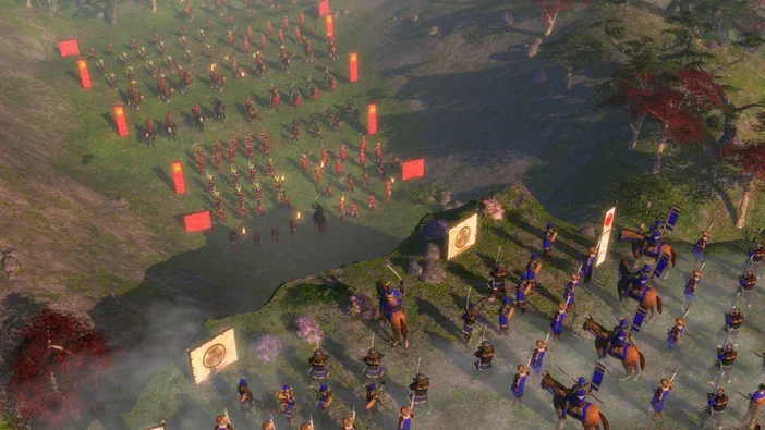 Age of Empires III : vue aérienne d'une bataille avec des troupes en formation sur un terrain vallonné.