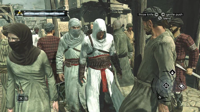 Capture d'écran du jeu Assassin's Creed montrant un personnage en tenue blanche au centre entouré de plusieurs autres personnages dans une rue animée.