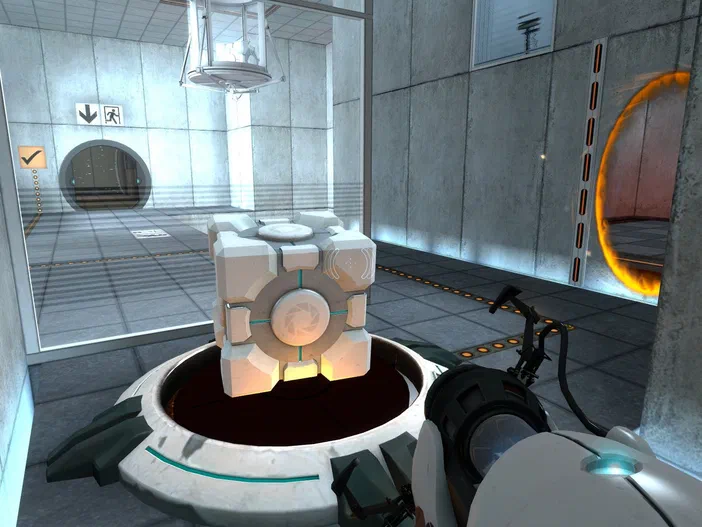 Capture d'écran du jeu vidéo Portal montrant un cube blanc sur une plateforme dans un environnement industriel.