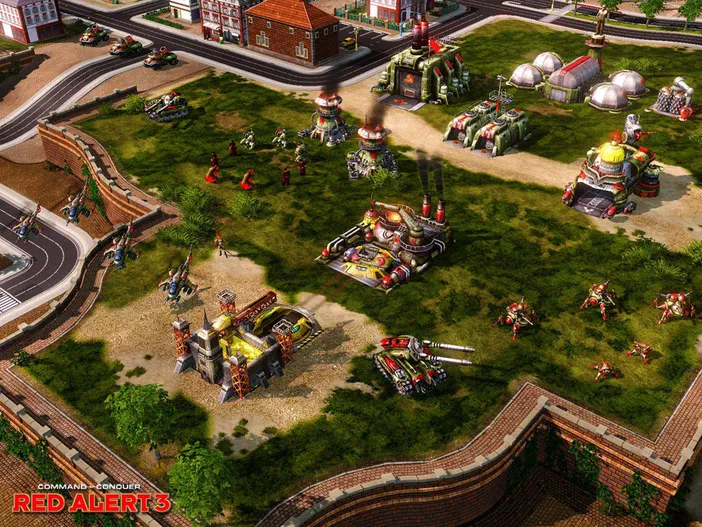 Capture d'écran du jeu vidéo Command & Conquer Red Alert 3 montrant une base militaire avec des bâtiments et des troupes sur un terrain herbeux.