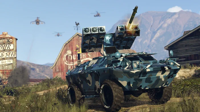 Un véhicule blindé de type APC avec un lance-roquettes multiples est stationné dans une zone rurale, devant des bâtiments en bois et à l'arrière-plan plusieurs hélicoptères survolent la scène.