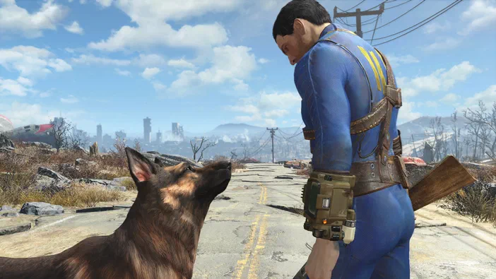 Dans Fallout 4, un personnage en combinaison bleue et une chien regardent vers l'horizon d'une ville post-apocalyptique.