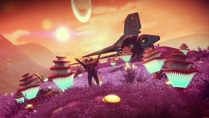Dans le jeu vidéo No Man's Sky, un personnage se tient au milieu d'un champ de fleurs violettes sous un ciel orange avec une planète en arrière-plan.