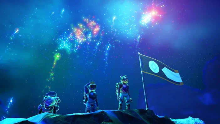 Dans le jeu vidéo No Man's Sky, trois astronautes plantent un drapeau sur une planète sous des feux d'artifice spatiaux.