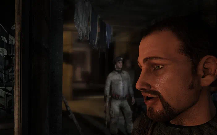 Dans le jeu vidéo Metro 2033, un personnage à barbe regarde vers la gauche tandis qu'un soldat en arrière-plan se tient dans une zone sombre.
