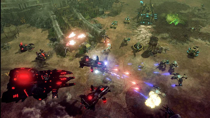 Capture d'écran de Command & Conquer™ 4 Tiberian Twilight montrant une bataille entre des unités technologiques sur un terrain désolé.