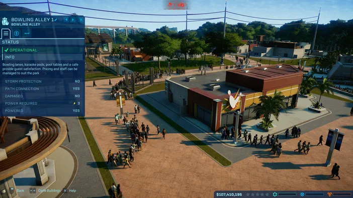 Capture d'écran du jeu Jurassic World Evolution montrant une vue aérienne d'un bowling avec des dinosaures et un panneau de gestion à gauche.