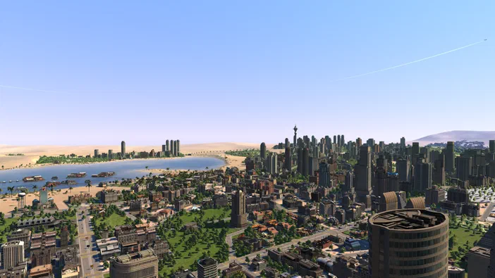 Vue aérienne d'une ville dense avec des gratte-ciels et une plage bordée de palmiers dans le jeu Cities XL Platinum.