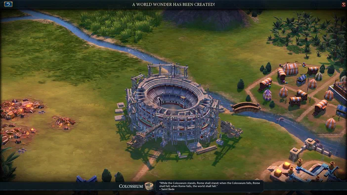 Dans Sid Meier's Civilization VI, une vue aérienne d'une ville avec un Colisée en construction au centre et des tentes à droite.