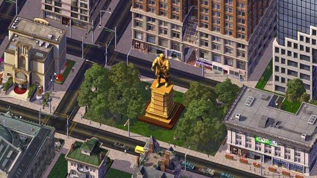 Vue aérienne d'une ville de SimCity avec un monument doré au centre entouré d'arbres et de bâtiments modernes.