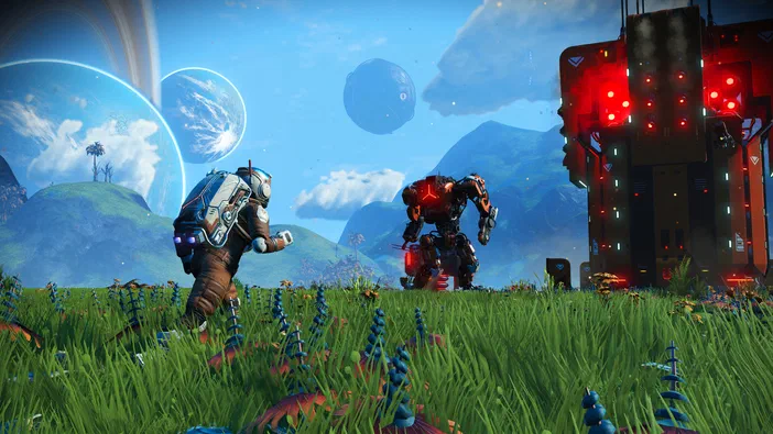 Dans le jeu vidéo No Man's Sky, un personnage en combinaison spatiale et un robot se tiennent dans une prairie colorée sous un ciel étoilé avec des planètes.