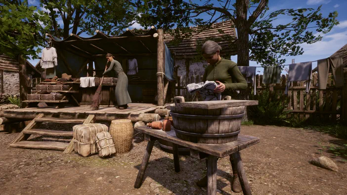 Dans le jeu vidéo Medieval Dynasty, deux personnages féminins s'occupent des tâches ménagères dans une cour de ferme médiévale : l'une brosse un porche en bois tandis que l'autre plonge du linge dans une cuve.