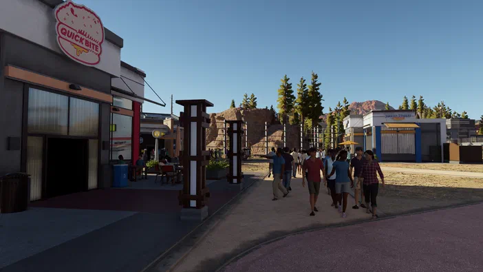 Vue d'un parc de Jurassic World Evolution avec des restaurants, boutiques et stands en arrière-plan.