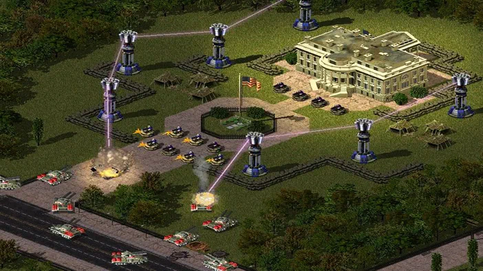 Capture d'écran de Command & Conquer : Red Alert 2 montrant une base avec des tours laser et des chars en combat.