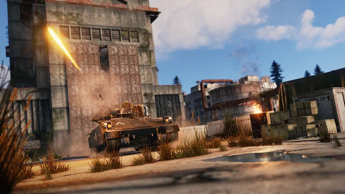 Dans le jeu Rust, un véhicule blindé avance sur une route en ruine devant des bâtiments endommagés sous un ciel bleu.