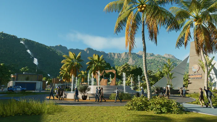 Vue du parc de Jurassic World Evolution sur l'île de Kauai, avec des palmiers et un monument.