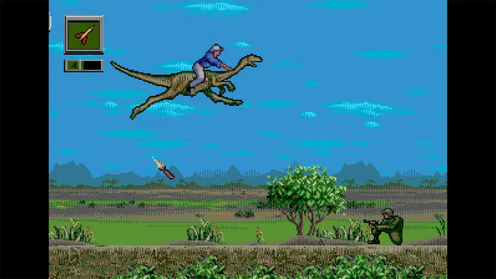 Capture d'écran du jeu Jurassic Park Classic Games Collection montrant un dinosaure chevauché par un personnage au-dessus d'un paysage avec des soldats et une lance en vol.